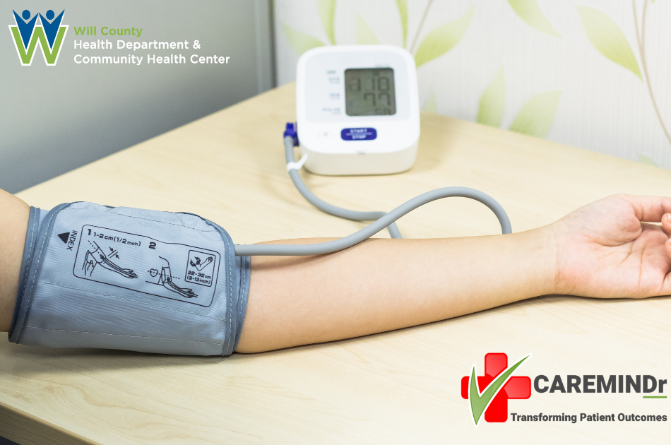 Photo of persons arm with blood pressure cuff and machine