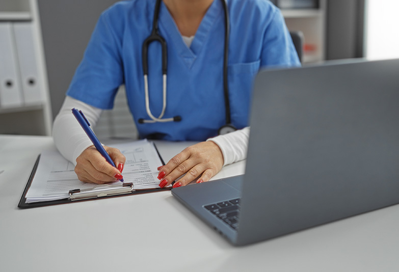 nurse-computer Nurse filling out paperwork