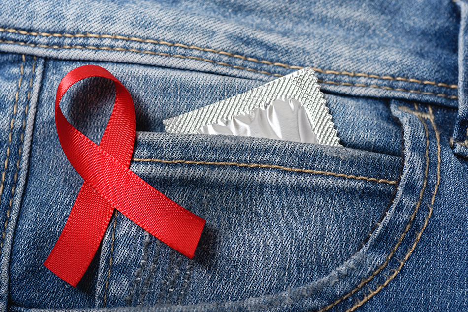 ribbon-HIV Condom in back jeans pocket with HIV ribbon